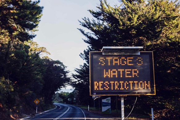A sign on the road to Apollo Bay warns visitors of water restrictions. 