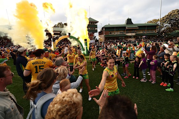 Australia run out before a packed house at North Sydney Oval.