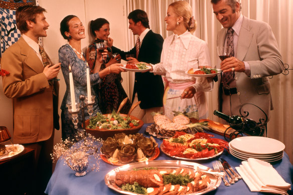 A stock image of a dinner party from the 1970s, a time when the humble potato bake was respected.