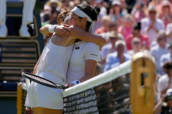 Tunisia’s Ons Jabeur (right) embraces Germany’s Tatjana Maria at the net after beating her.