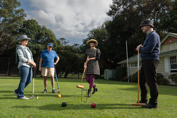 Lana Zegura, Manager of Incentives Engagement at Heritage NSW (centre) Stuart Read, Senior Heritage Officer at HNSW, Robyn Weihen and Rod Richardson play croquet at Sydney Croquet Clubhouse at Rose Bay. 