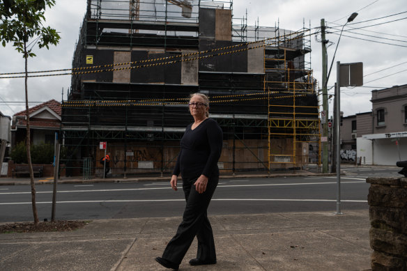 Kelsie Dadd, a founder of the residents group Save Marrickville, outside a forthcoming apartment block that she says is “not too bad”.