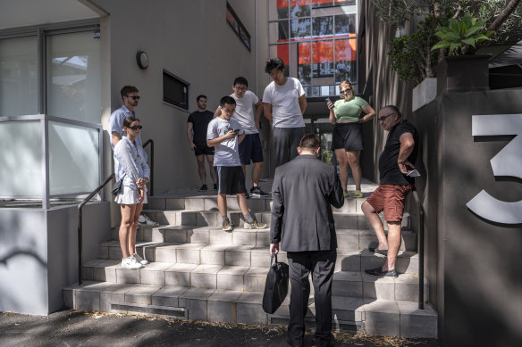 Young people line up for a rental inspection in Zetland, Sydney.