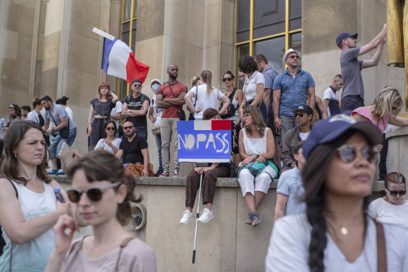 People attend a demonstration in Paris against the COVID-19 pass which grants vaccinated individuals greater ease of access to venues.