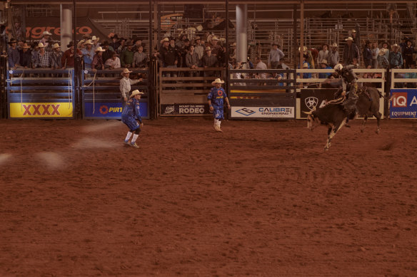 Well-padded “protection athletes” stand ready to get between rider and bull once the rider is thrown to the ground. “You’ve gotta have plenty of heart,” says Wanyi man Darryl Chong, pictured in blue, closest to the rider.