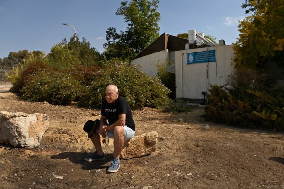 Australian Israeli Geoffrey “Danny” Majzner sits in front of the house of his sister, Galit Carbone, who was killed by Hamas during the October 7 attack on Kibbutz Be’eri.