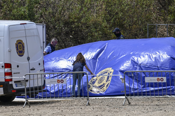 Portuguese police investigators dismantle base camp at the end of the three-day search for remains of Madeleine McCann at Barragem do Arade Reservoir in Silves, Portugal. 