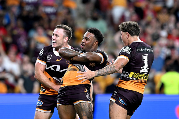 The Broncos celebrate a try by five-eighth Ezra Mam (centre) against the Dragons last weekend.