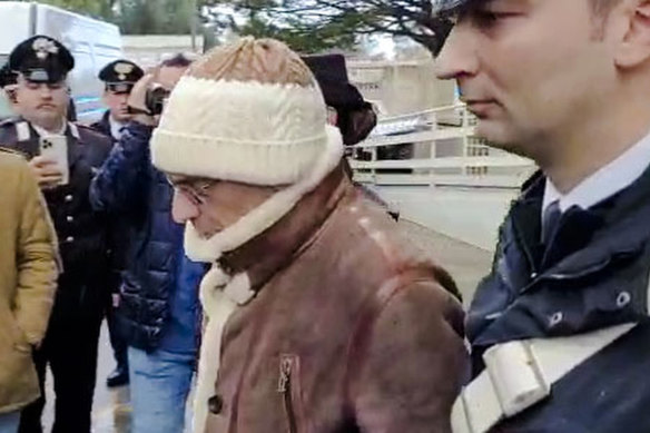 Top Mafia boss Matteo Messina Denaro, centre, lsoon after his arrest at a private clinic in Palermo, Sicily on January 16.