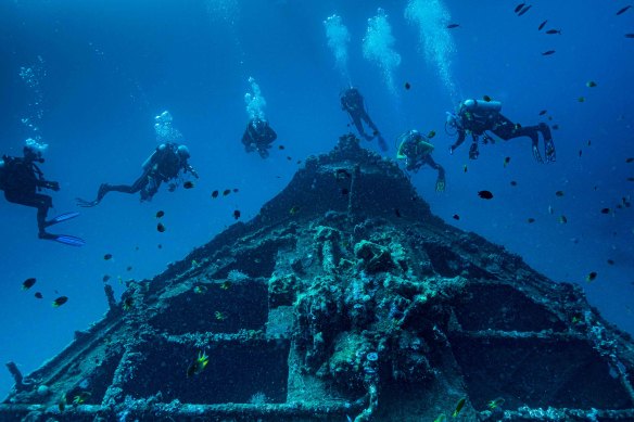 Divers can swim around scuttled ships as artificial reefs, suchas the Molas Wreck in Indonesia.