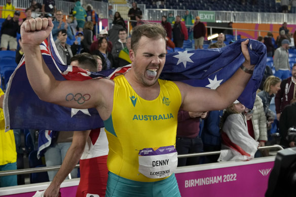 Matthew Denny celebrates after victory in the men’s discus.