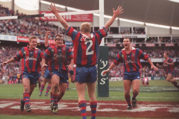 Iconic: Darren Albert scores for the Knights to win the 1997 grand final at the SFS.