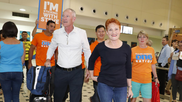 One Nation leader and senator Pauline Hanson is greeted by state leader Steve Dickson and party supporters at the Brisbane International Airport on Sunday.