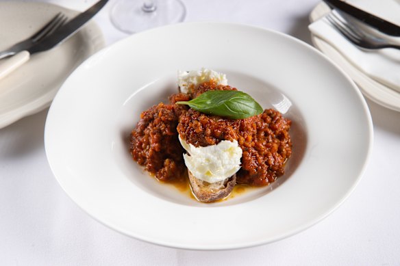 Mozzarella bolognese: meat sauce and cheese on a thick slice of toast.