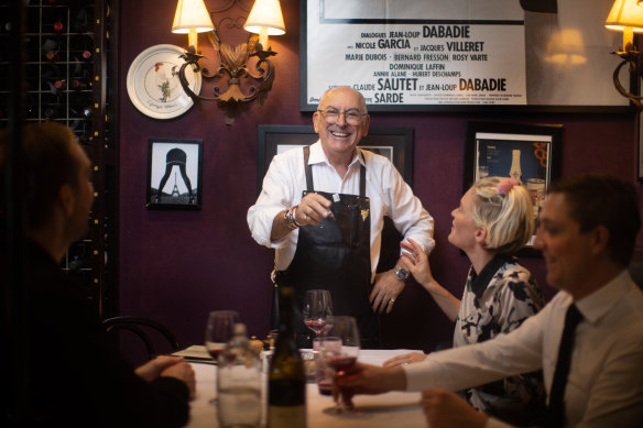 No bread plates: Bistro Thierry owner Thierry Cornevin with customers Alice Wells and Jack Lodge.