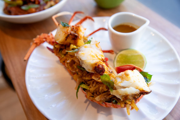 The signature lobster kottu comes with a jug of bisque-like curry sauce on the side.