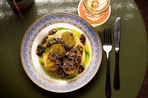Butter-poached leeks with truffle-hazelnut pesto.