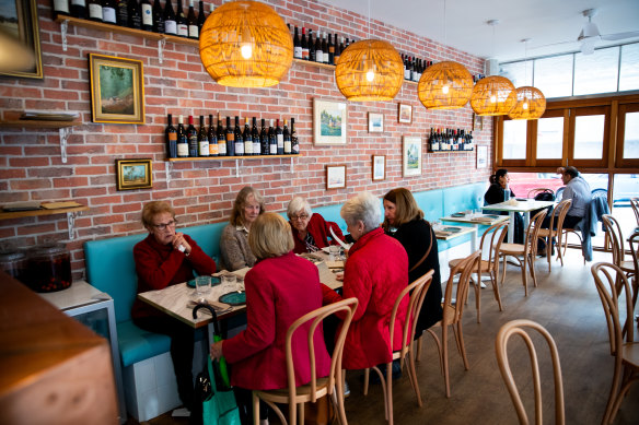 A long Tiffany-blue banquette pops against Bacari’s exposed brick walls. 