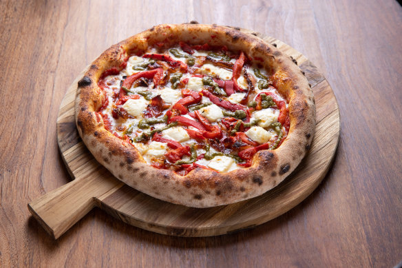 The Faz pizza topped with roasted peppers, pancetta, pesto, mozzarella and feta at Ohana.