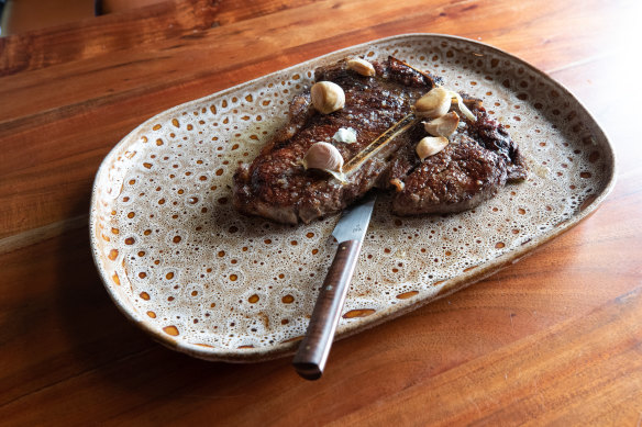 Cinder serves premium steaks, such as dry-aged Westholme Wagyu T-bone.