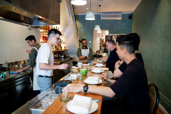 Stools line the counter, which runs most of the length of the skinny Surry Hills terrace.