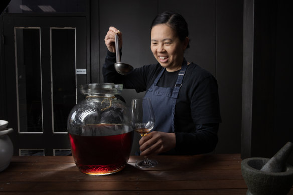 Chef Thi Le with a batch of the fish sauce she makes at Jeow.