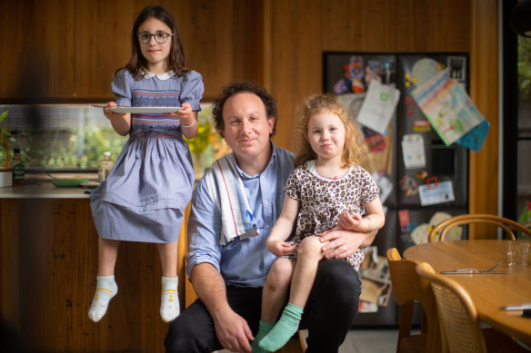 Troy Wheeler at home with his daughters Marlow and Juno.
