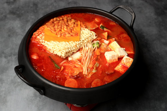 Giant cauldrons of army stew are a common sight on tables at Seven Star Pocha.
