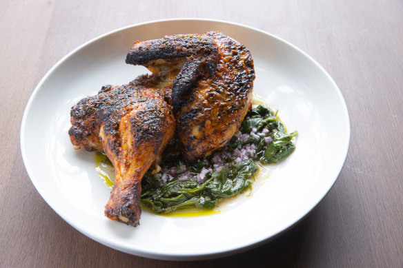 Barbecued chicken with rose harissa and warrigal greens, one of Rumi’s new dishes.