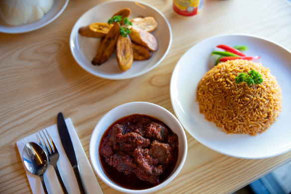 Fufu (top left), fried plantains, jollof rice and goat stew at Little Lagos in Sydney.