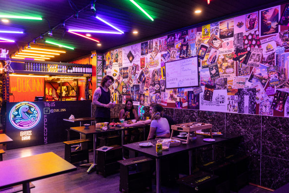 Duk Inn’s neon interior is a departure from conventional Chinese restaurant design.
