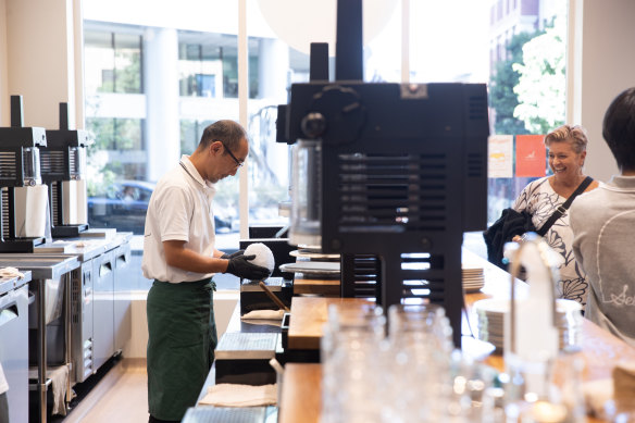 Hiroshi Kawamata works with ice to make Japanese shaved ice desserts known as kakigori.