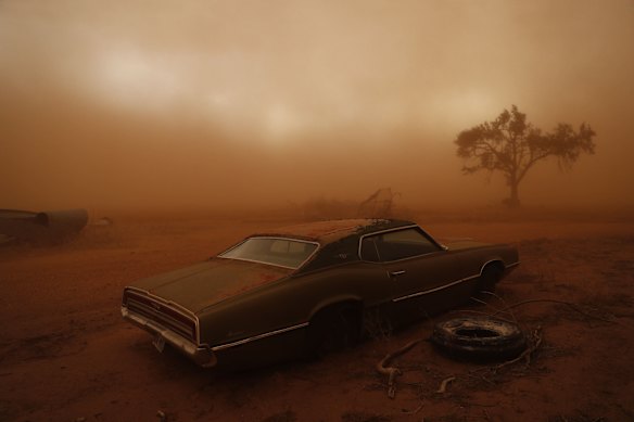 A rusting Ford Thunderbird is
swallowed by dust in Texas. Storm chasing in the USA in June,  2018. 