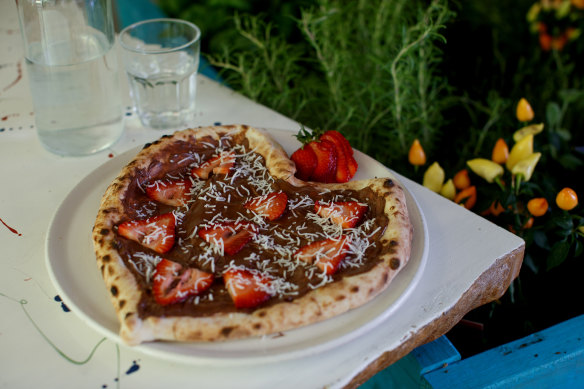 Nutella and strawberry dessert pizza.