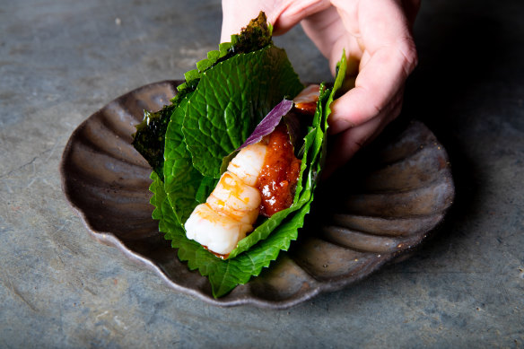 Aromatic leaves provide the wrapper for the Skull Island prawn “taco”.