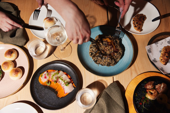 Fire-roasted whole baby pumpkin with mushroom risotto (centre right), and kingfish tiradito.