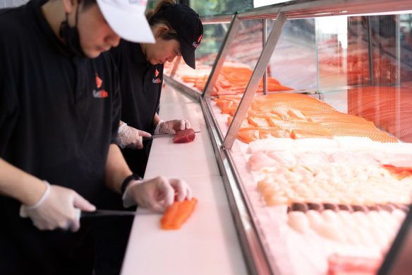 Chefs cut seafood to order at GetSashimi. 