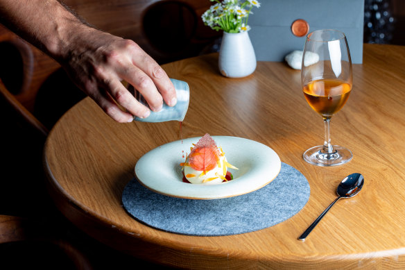 The finishing touches on the dessert of camarosa strawberries, bee pollen, chamomile cake, milk ice-cream and cream of sweet herbs. 