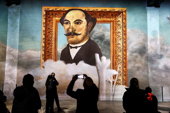 Visitors attend a preview of the immersive exhibition: “Le Douanier Rousseau, Au Pays Des Reves - Rousseau, A world of dreams” at Atelier Des Lumieres in Paris, France.