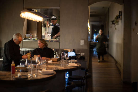 The front room at Etta, with the open kitchen beyond.