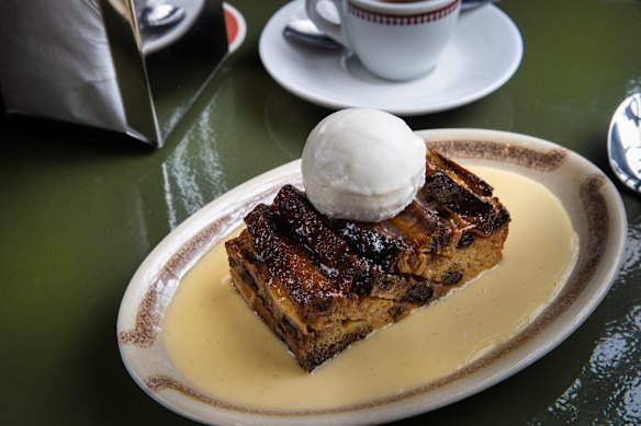 Bread and butter pudding comes with a generous quantity of custard.