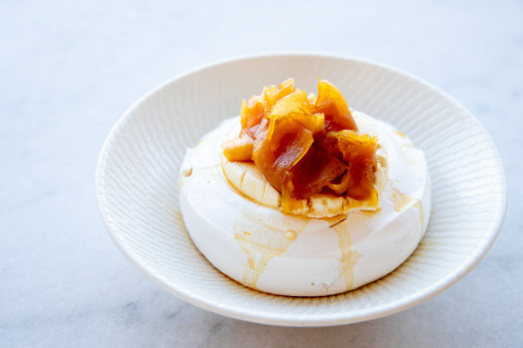 Pineapple pavlova with creme fraiche and molasses.