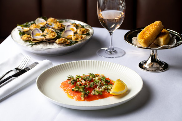 Clockwise from top left: Clams casino, crumpets and Ora King salmon gravalax at Bistro George in Sydney.