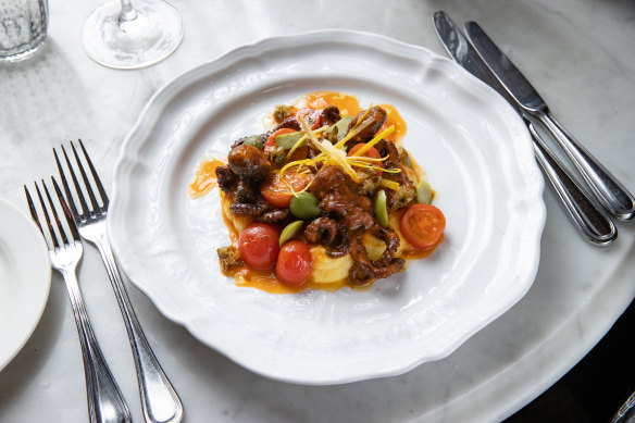 Baby octopus with red wine, tomato, olives and soft polenta.