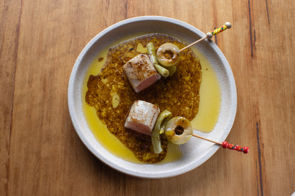 Torched kingfish skewered with gordal olives.