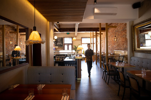 The Post Office Club Hotel in St Kilda features Frenchy light fittings and checked banquettes.