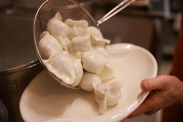 Pork and Chinese sauerkraut dumplings, freshly boiled.