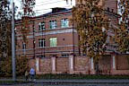 A woman with her child walks past the Irkutsk Anti-Plague Research Institute of Siberia and the Far East in Irkutsk, Russia, on Wednesday, October7.
