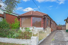 The offering: A single-fronted brick-and-concrete bungalow under the Kingsford Smith Airport flight path.