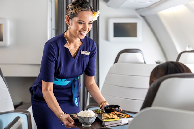 Hawaiian airlines crew serving food